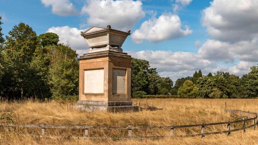 Gray's Monument shown in Gray's Field surrounded by long summer grass